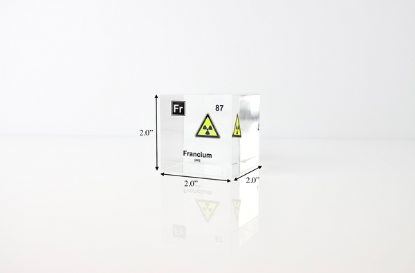 Clear acrylic cube displaying a Francium element (Atomic Number 87) embedded within, offering a scientific presentation for collectors and science enthusiasts.