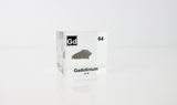 Clear acrylic cube displaying a Gadolinium element (Atomic Number 64) embedded within, offering a scientific presentation for collectors and science enthusiasts.