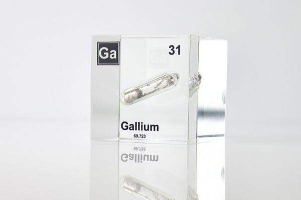 Gallium element encased in a clear acrylic cube, featuring its name, atomic number 31, and properties as displayed on the periodic table. Ideal for educational and collector use.