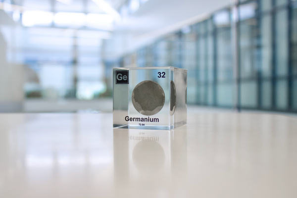 Clear acrylic cube displaying Germanium element with its name, atomic number 32, and periodic table properties. Perfect for educational purposes and collectors.