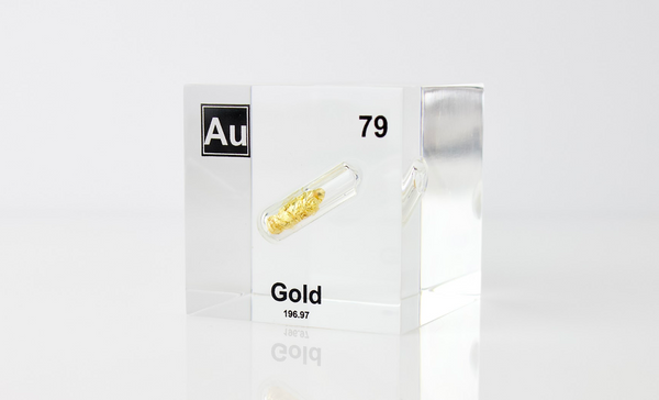 Clear acrylic cube displaying a Gold element (Atomic Number 79) embedded within, offering a scientific presentation for collectors and science enthusiasts.