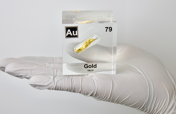 Clear acrylic cube displaying a Gold element (Atomic Number 79) embedded within, offering a scientific presentation for collectors and science enthusiasts.