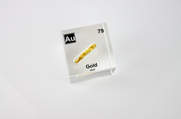 Clear acrylic cube displaying a Gold element (Atomic Number 79) embedded within, offering a scientific presentation for collectors and science enthusiasts.