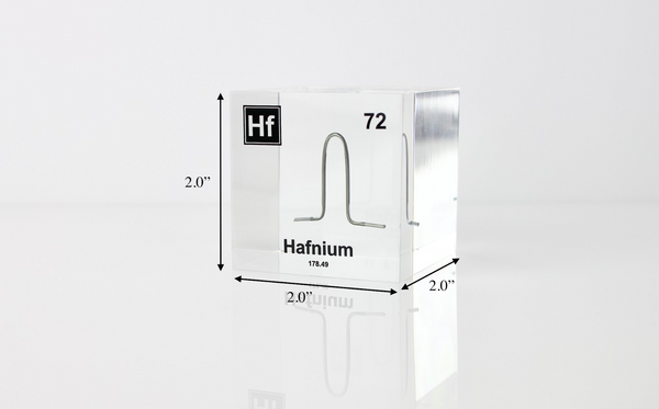 Clear acrylic cube displaying a Hafnium element (Atomic Number 72) embedded within, offering a scientific presentation for collectors and science enthusiasts.