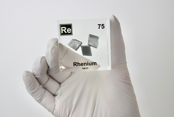 Rhenium element in a clear acrylic cube, featuring its name, atomic number, and properties as shown on the periodic table. A sleek and educational display for collectors and enthusiasts.