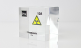Clear acrylic cube displaying a Hassium element (Atomic Number 108) embedded within, offering a scientific presentation for collectors and science enthusiasts.