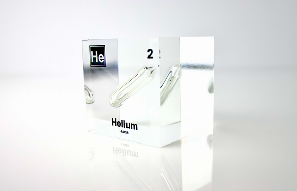 Clear acrylic cube displaying a Helium element (Atomic Number 2) embedded within, offering a scientific presentation for collectors and science enthusiasts.