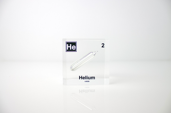 Clear acrylic cube displaying a Helium element (Atomic Number 2) embedded within, offering a scientific presentation for collectors and science enthusiasts.