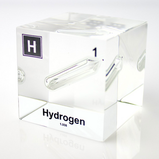 Clear acrylic cube displaying a Hydrogen element (Atomic Number 1) embedded within, offering a scientific presentation for collectors and science enthusiasts.