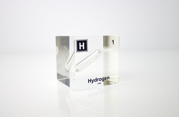 Clear acrylic cube displaying a Hydrogen element (Atomic Number 1) embedded within, offering a scientific presentation for collectors and science enthusiasts.