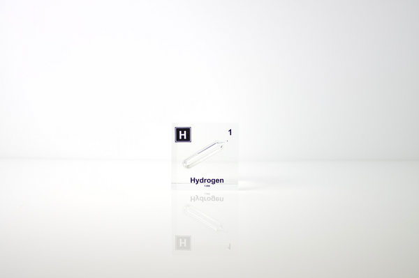 Clear acrylic cube displaying a Hydrogen element (Atomic Number 1) embedded within, offering a scientific presentation for collectors and science enthusiasts.