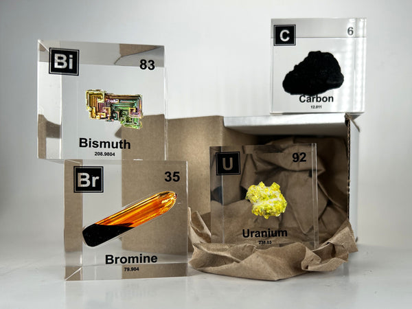 Bismuth, bromine, carbon, and uranium elements cubes to build your complete periodic table with element subscription.