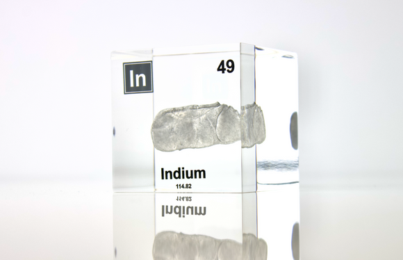 Clear acrylic cube displaying an Indium element (Atomic Number 49) embedded within, offering a scientific presentation for collectors and science enthusiasts.