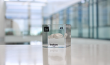 Clear acrylic cube displaying an Indium element (Atomic Number 49) embedded within, offering a scientific presentation for collectors and science enthusiasts.