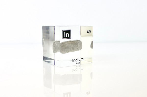 Clear acrylic cube displaying an Indium element (Atomic Number 49) embedded within, offering a scientific presentation for collectors and science enthusiasts.