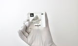 Clear acrylic cube displaying an Indium element (Atomic Number 49) embedded within, offering a scientific presentation for collectors and science enthusiasts.