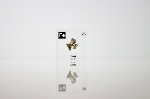 Iron element encased in a clear acrylic cube, featuring its name, atomic number, and key properties from the periodic table. A striking and educational display for science enthusiasts and collectors