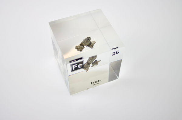 Iron element encased in a clear acrylic cube, featuring its name, atomic number, and key properties from the periodic table. A striking and educational display for science enthusiasts and collectors