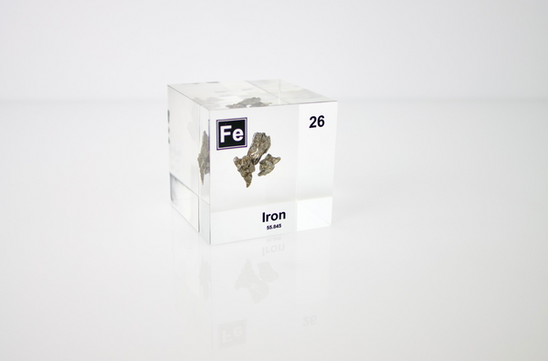 Iron element encased in a clear acrylic cube, featuring its name, atomic number, and key properties from the periodic table. A striking and educational display for science enthusiasts and collectors