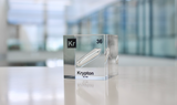 Clear acrylic cube displaying a Krypton element (Atomic Number 36) embedded within, offering a scientific presentation for collectors and science enthusiasts.
