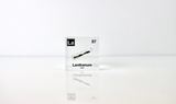 Clear acrylic cube displaying a Lanthanum element (Atomic Number 57) embedded within, offering a scientific presentation for collectors and science enthusiasts.