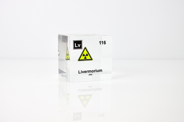 Clear acrylic cube displaying a Livermorium element (Atomic Number 116) embedded within, offering a scientific presentation for collectors and science enthusiasts.