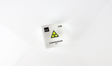 Clear acrylic cube displaying a Livermorium element (Atomic Number 116) embedded within, offering a scientific presentation for collectors and science enthusiasts.