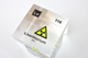 Clear acrylic cube displaying a Livermorium element (Atomic Number 116) embedded within, offering a scientific presentation for collectors and science enthusiasts.