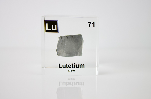 Clear acrylic cube displaying a Lutetium element (Atomic Number 71) embedded within, offering a scientific presentation for collectors and science enthusiasts.