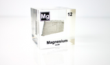 Clear acrylic cube featuring a Magnesium ampule with its atomic number 12. Ideal for educational displays, scientific collections, or as a distinctive decorative item.