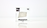 Clear acrylic cube featuring a Magnesium ampule with its atomic number 12. Ideal for educational displays, scientific collections, or as a distinctive decorative item.