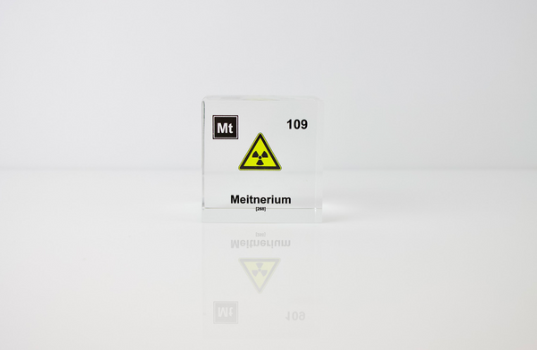 Clear acrylic cube displaying a Meitnerium element (Atomic Number 109) embedded within, offering a scientific presentation for collectors and science enthusiasts.