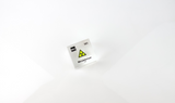 Clear acrylic cube displaying a Mendelevium element (Atomic Number 101) embedded within, offering a scientific presentation for collectors and science enthusiasts.