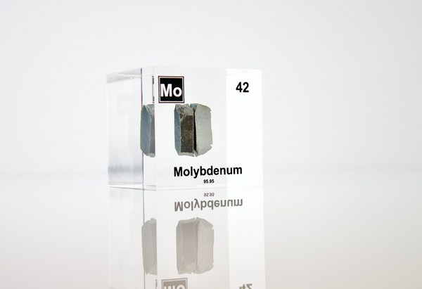 Clear acrylic cube displaying a Molybdenum element (Atomic Number 42) embedded within, offering a scientific presentation for collectors and science enthusiasts.