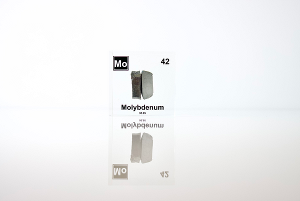 Clear acrylic cube displaying a Molybdenum element (Atomic Number 42) embedded within, offering a scientific presentation for collectors and science enthusiasts.