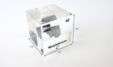 Clear acrylic cube displaying a Molybdenum element (Atomic Number 42) embedded within, offering a scientific presentation for collectors and science enthusiasts.