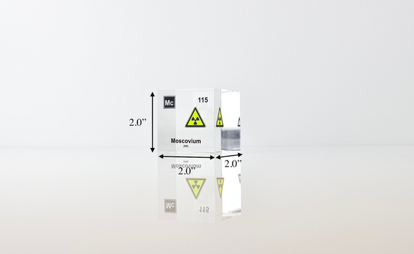 Clear acrylic cube displaying a Moscovium element (Atomic Number 115) embedded within, offering a scientific presentation for collectors and science enthusiasts.