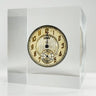 Clear acrylic display case showcasing a detailed watch face with hands and markers, offering a stylish presentation for watch enthusiasts and collectors.