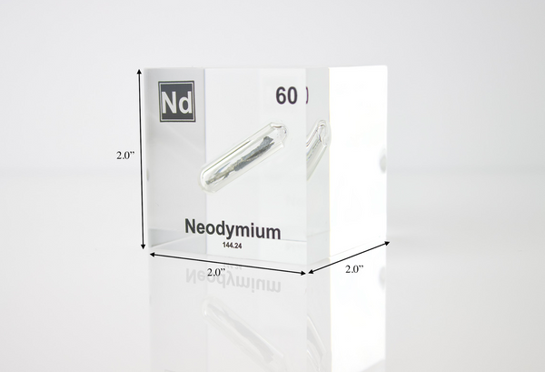 Clear acrylic cube displaying a Neodymium element (Atomic Number 60) embedded within, offering a scientific presentation for collectors and science enthusiasts.