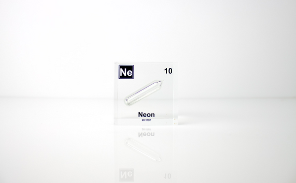 Clear acrylic cube encasing a Neon ampule with its atomic number 10. Ideal for display in educational settings, scientific collections, or as a decorative piece.