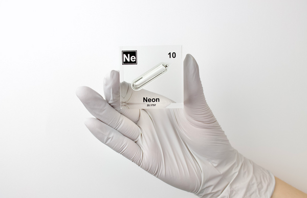 Clear acrylic cube encasing a Neon ampule with its atomic number 10. Ideal for display in educational settings, scientific collections, or as a decorative piece.