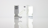 Clear acrylic cube encasing a Neon ampule with its atomic number 10. Ideal for display in educational settings, scientific collections, or as a decorative piece.