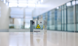 Clear acrylic cube displaying a Neptunium element (Atomic Number 93) embedded within, offering a scientific presentation for collectors and science enthusiasts.