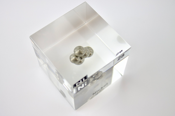 Nickel element, atomic number 28, in a clear acrylic cube, displaying its name, atomic number, and key properties as shown on the periodic table. An educational and informative piece ideal for science enthusiasts and collectors.