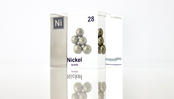 Nickel element, atomic number 28, in a clear acrylic cube, displaying its name, atomic number, and key properties as shown on the periodic table. An educational and informative piece ideal for science enthusiasts and collectors.