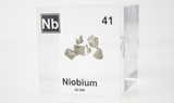 Clear acrylic cube displaying a Niobium element (Atomic Number 41) embedded within, offering a scientific presentation for collectors and science enthusiasts.