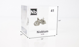 Clear acrylic cube displaying a Niobium element (Atomic Number 41) embedded within, offering a scientific presentation for collectors and science enthusiasts.