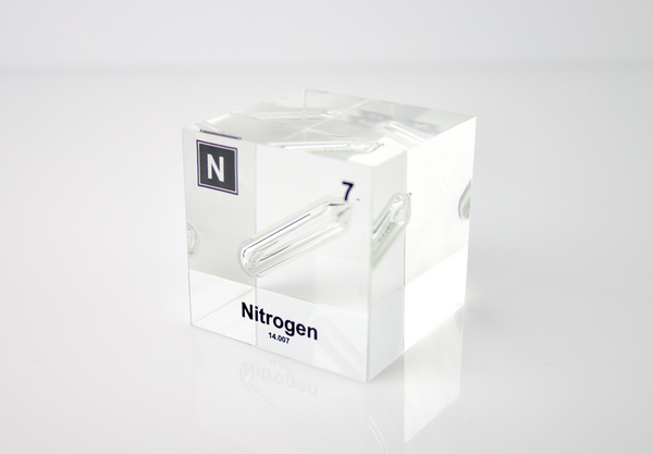 Clear acrylic cube encasing a Nitrogen ampule with its atomic number 7. Ideal for display in educational settings, scientific collections, or as a decorative piece.