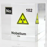 Clear acrylic cube displaying a Nobelium element (Atomic Number 102) embedded within, offering a scientific presentation for collectors and science enthusiasts.