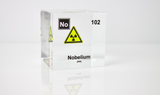Clear acrylic cube displaying a Nobelium element (Atomic Number 102) embedded within, offering a scientific presentation for collectors and science enthusiasts.
